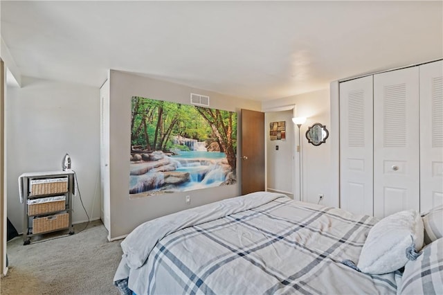 carpeted bedroom featuring a closet and visible vents