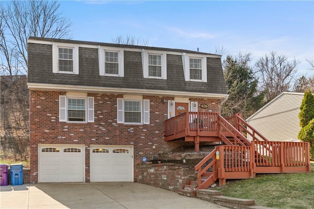 view of front of property with roof with shingles, mansard roof, concrete driveway, brick siding, and an attached garage