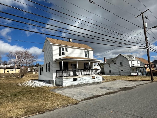 view of front of house featuring a front lawn and a porch