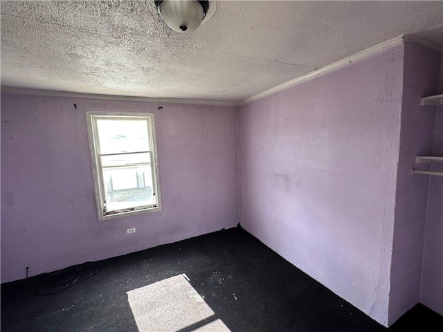 empty room featuring unfinished concrete floors and a textured ceiling