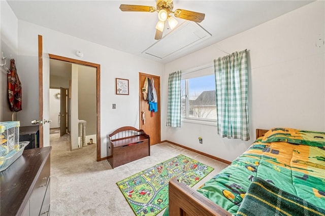 bedroom with light colored carpet, baseboards, and ceiling fan