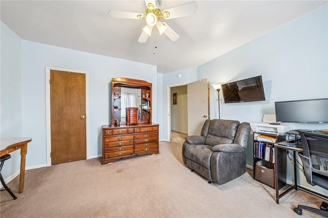 office area with carpet flooring, baseboards, and ceiling fan