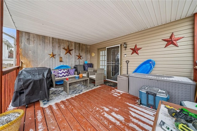 deck featuring a grill and outdoor lounge area