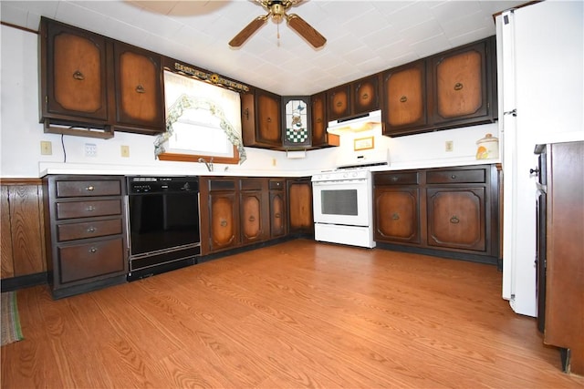 kitchen with gas range gas stove, light countertops, under cabinet range hood, dishwasher, and light wood-type flooring