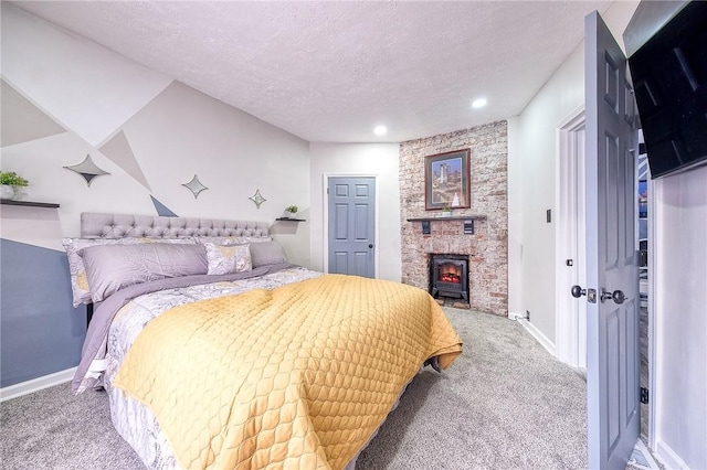 carpeted bedroom with baseboards and a textured ceiling