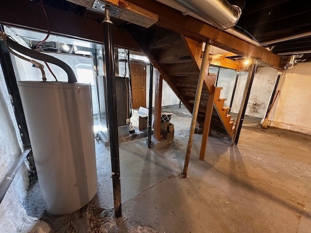 unfinished below grade area with stairs and water heater