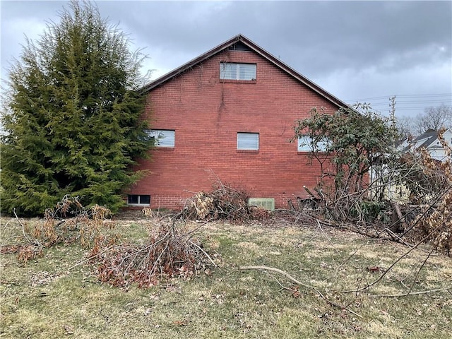 view of home's exterior featuring brick siding