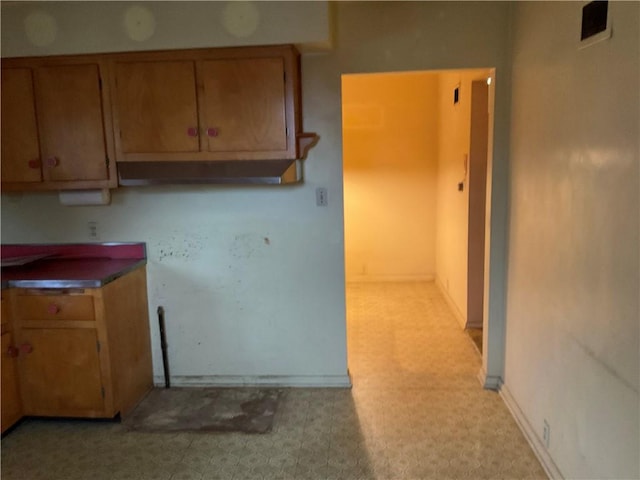 kitchen featuring brown cabinets