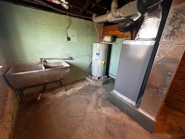 utility room with a sink and electric water heater