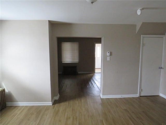 interior space featuring wood finished floors and baseboards