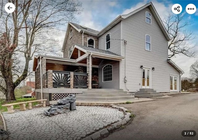 rear view of property with french doors