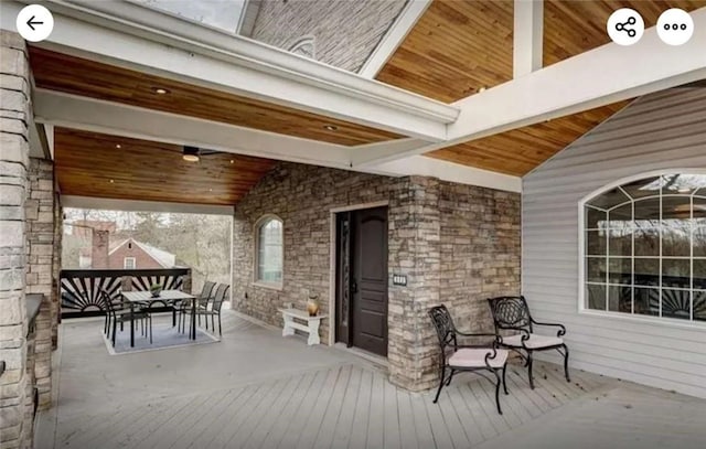 wooden deck with outdoor dining space