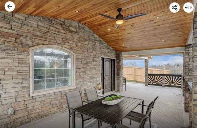 view of patio / terrace with outdoor dining area, a ceiling fan, and fence