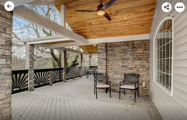 wooden terrace featuring ceiling fan