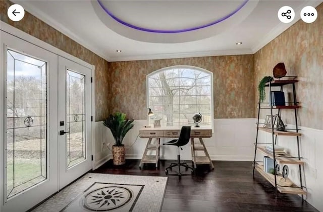 home office featuring wood finished floors, a wainscoted wall, crown molding, french doors, and a raised ceiling