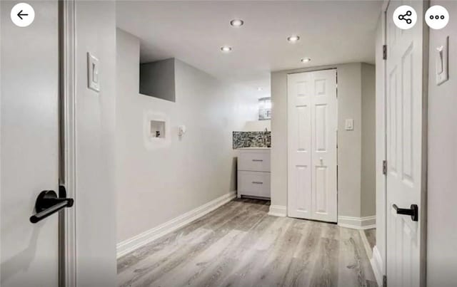 washroom with light wood finished floors, baseboards, washer hookup, laundry area, and recessed lighting