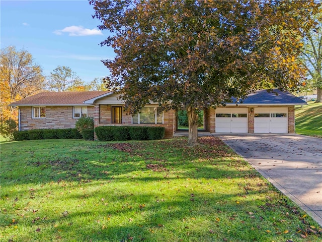 single story home with a front yard, concrete driveway, a garage, and stone siding