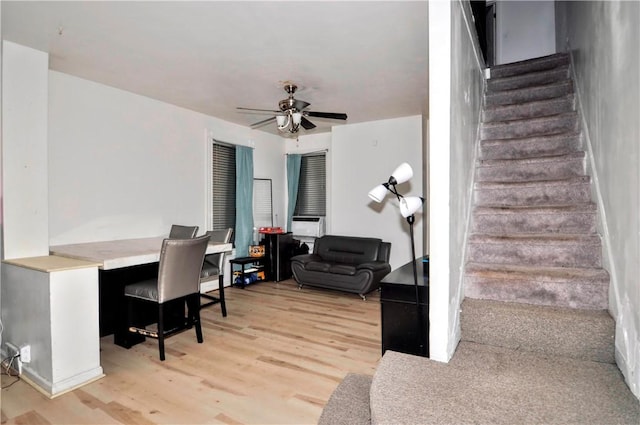 interior space with wood finished floors and a ceiling fan