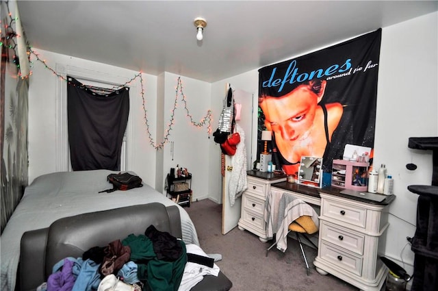 bedroom featuring dark carpet