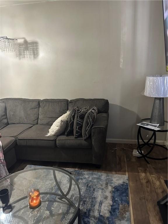 living room with wood finished floors and baseboards