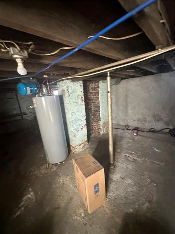 unfinished basement featuring gas water heater