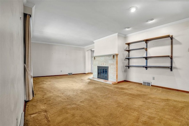 unfurnished living room with visible vents, carpet flooring, a fireplace, and ornamental molding