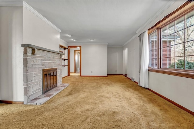 unfurnished living room with a stone fireplace, baseboards, carpet floors, and ornamental molding