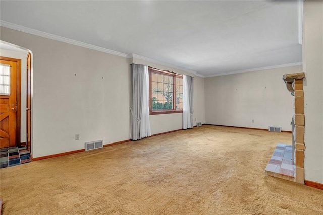 unfurnished living room with carpet flooring, visible vents, and a wealth of natural light