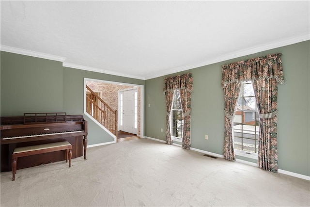 living area featuring visible vents, crown molding, baseboards, stairs, and carpet flooring