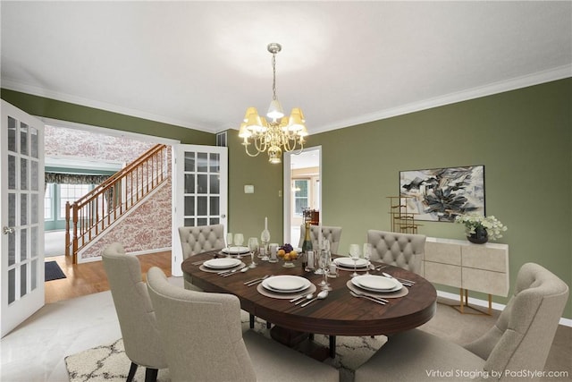 dining room with stairway, wood finished floors, baseboards, crown molding, and a chandelier