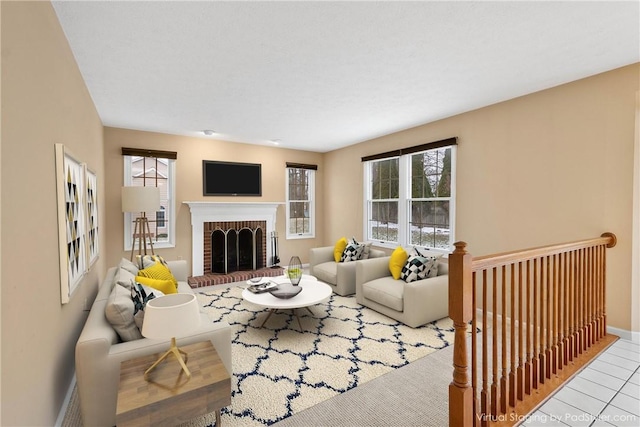 living room featuring a fireplace and a wealth of natural light