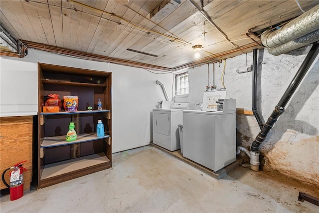 basement featuring wooden ceiling and washer and clothes dryer