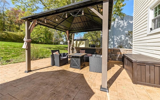 view of patio featuring a gazebo and an outdoor fire pit