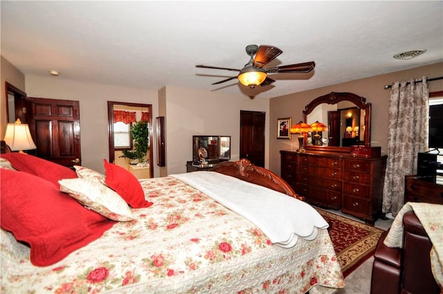 carpeted bedroom featuring ceiling fan