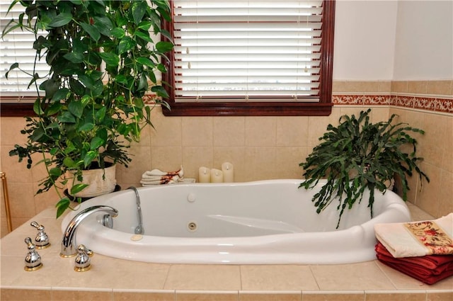 full bath with a tub with jets