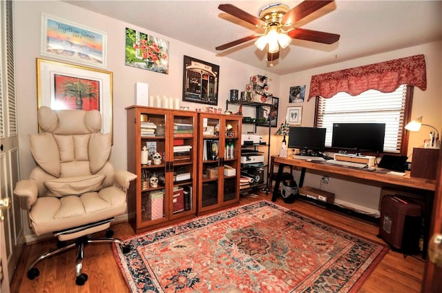 home office with ceiling fan and wood finished floors