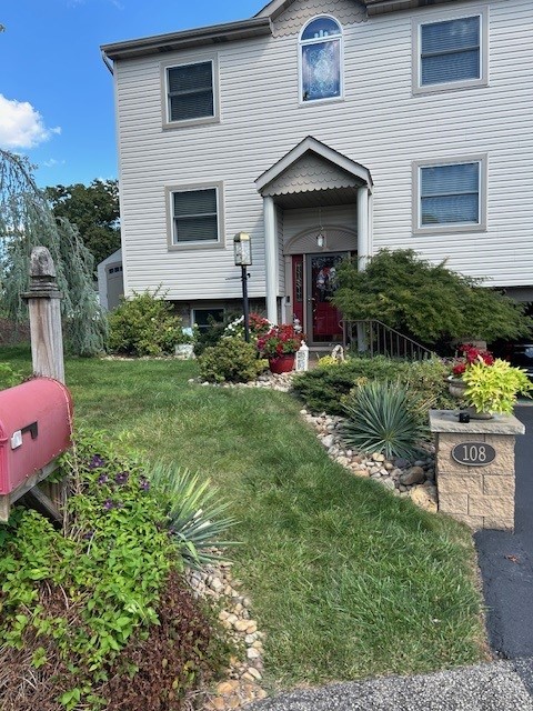 view of front of home with a front yard