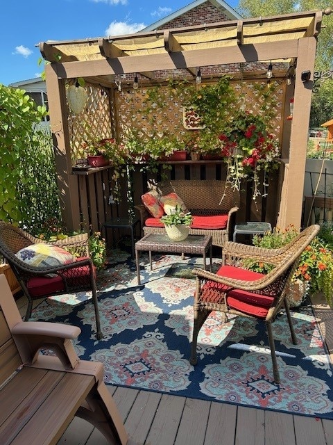 exterior space featuring a pergola and a wooden deck