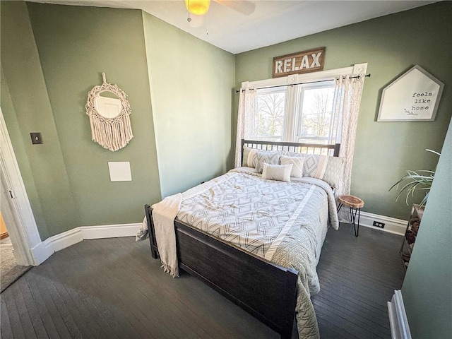 bedroom featuring ceiling fan, baseboards, and wood-type flooring