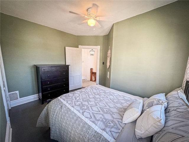 bedroom with visible vents, baseboards, and ceiling fan