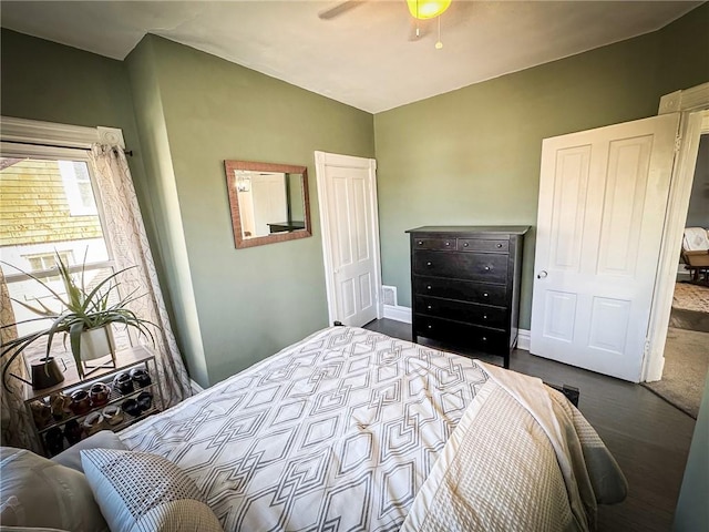 bedroom featuring vaulted ceiling, baseboards, and ceiling fan