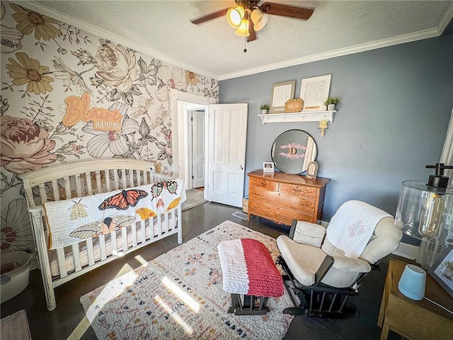 bedroom with a textured ceiling, a ceiling fan, wallpapered walls, and ornamental molding