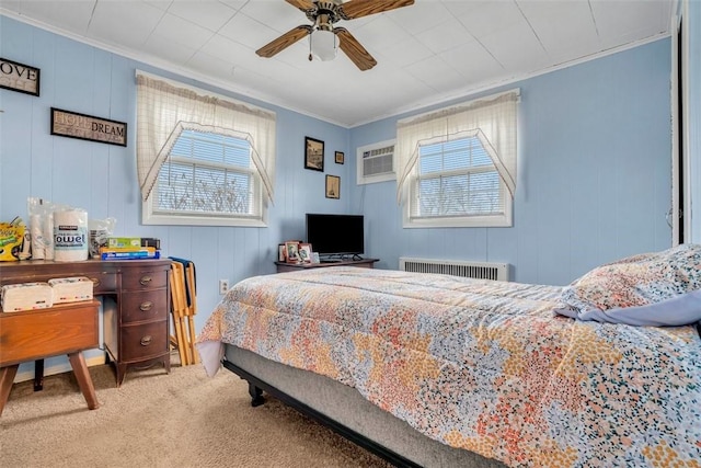 carpeted bedroom with multiple windows, radiator heating unit, and ornamental molding