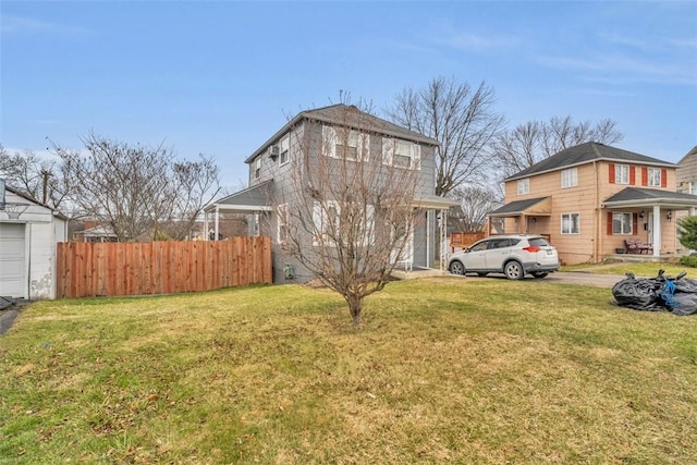 exterior space featuring a yard and fence