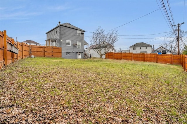 view of yard featuring a fenced backyard