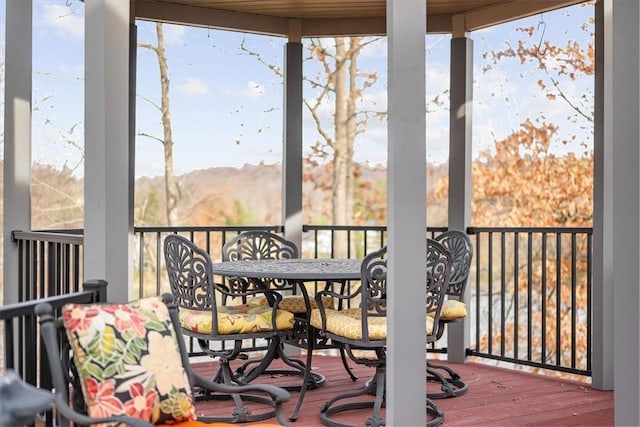 sunroom / solarium with plenty of natural light and a mountain view