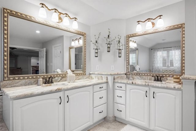 full bath with two vanities and a sink