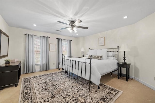 bedroom with visible vents, baseboards, ceiling fan, light colored carpet, and recessed lighting