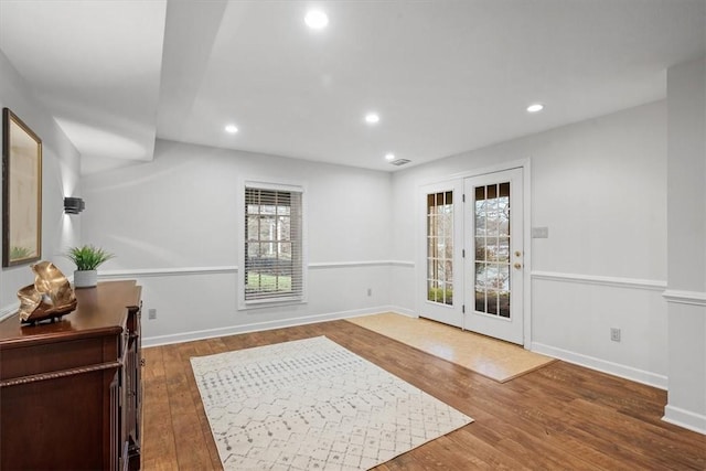 interior space with recessed lighting, baseboards, and wood finished floors