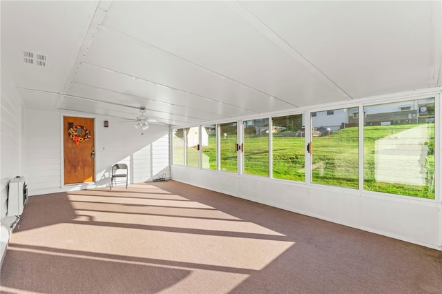 sunroom with visible vents and ceiling fan